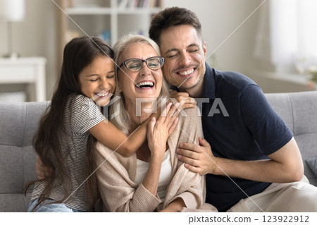 Young son preteen age grandkid cuddle to beloved mommy granny Young son preteen age grandkid cuddle to beloved mommy granny 123922912