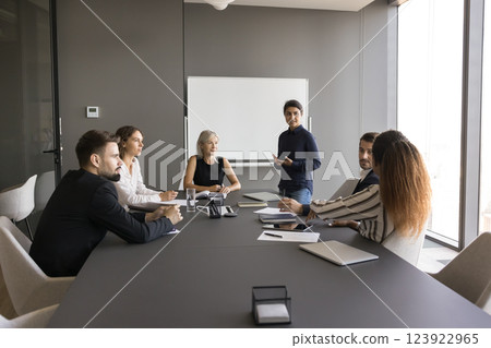 Professional business team communicating in modern conference room Professional business team communicating in modern conference room 123922965