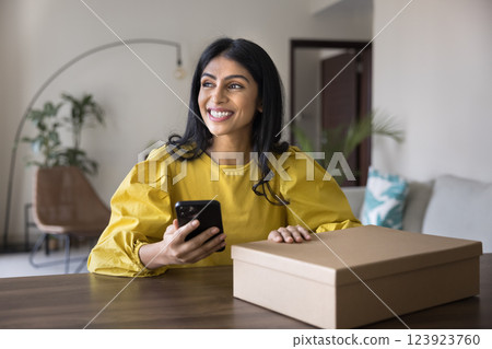 Woman leaves positive feedback, calling to courier to dispatch parcel Woman leaves positive feedback, calling to courier to dispatch parcel 123923760