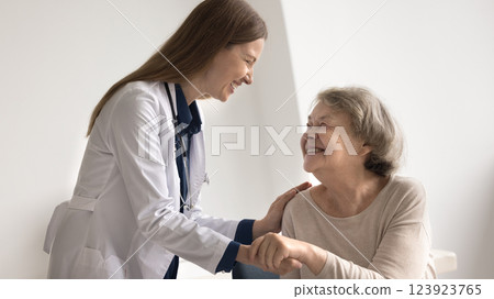 Smiling older female patient express gratitude to caring woman doctor 123923765