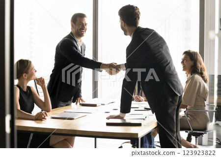Businessmen shaking hands, establish strategic alliance between two companies Businessmen shaking hands, establish strategic alliance between two companies 123923822