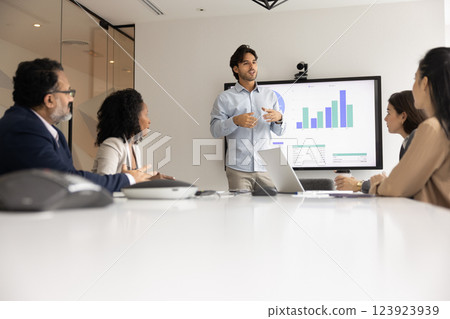 Serious motivated young speaker giving marketing presentation to business colleagues 123923939
