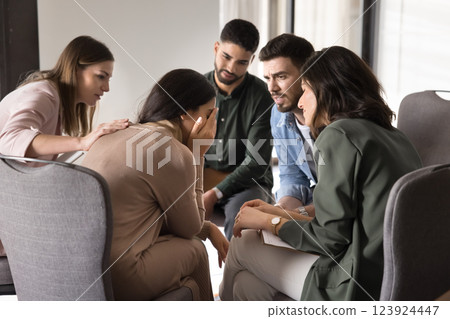 People listen woman sharing life problems during social community meeting 123924447