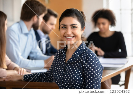 Independent, confident female, office employee posing for camera 123924562
