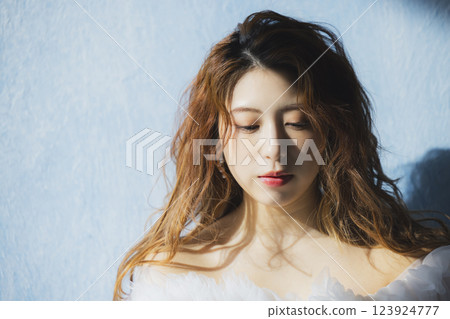 A woman in a white dress A woman in a white dress 123924777