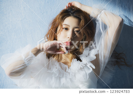 A woman in a white dress A woman in a white dress 123924783