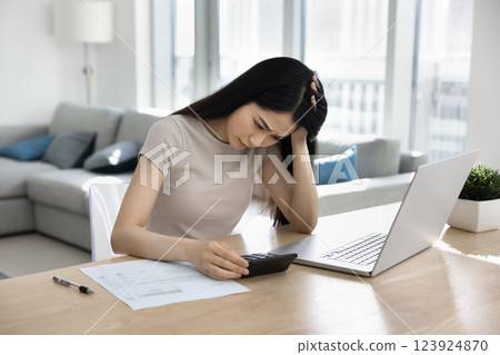 Woman feels upset due to unable to pay for bills Woman feels upset due to unable to pay for bills 123924870