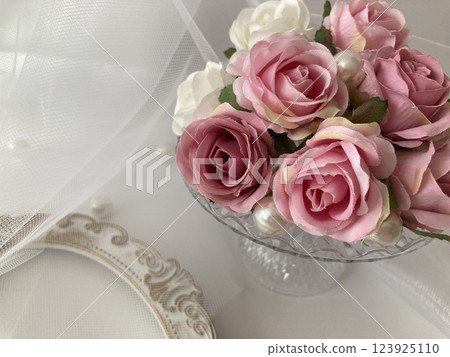 Pink roses on a cake stand Pink roses on a cake stand 123925110
