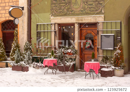 Snowy Cafe Entrance in Old Town Poznan, Poland 123925672