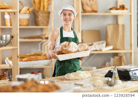 Teenage girl with homemade bread in bakery 123928594