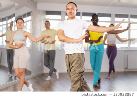 Young Asian man practicing aerobic dance in training hall 123928897