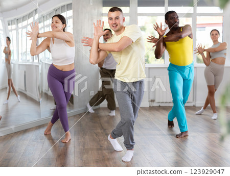 Young man practicing active dance in training hall 123929047