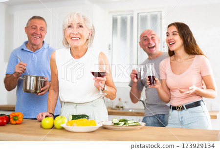 Happy family is preparing a festive dinner in the kitchen Happy family is preparing a festive dinner in the kitchen 123929134
