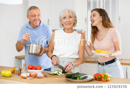 Happy family in the kitchen having fun Happy family in the kitchen having fun 123929150
