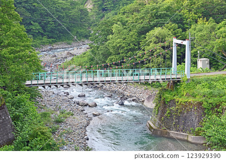 Kiriaki Suspension Bridge leading to Kawara no Yu in Akiyamago Kiriaki Kiriaki Suspension Bridge leading to Kawara no Yu in Akiyamago Kiriaki 123929390