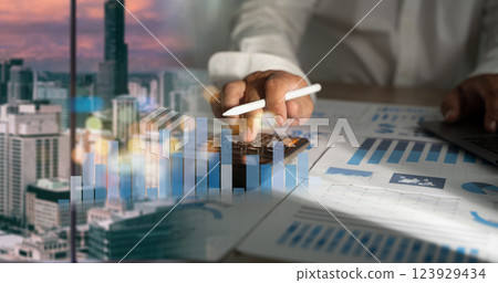 man is using a calculator budgeting and tax calculation budget management man is using a calculator budgeting and tax calculation budget management 123929434