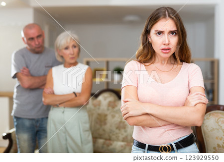 Daughter-in-law is offended by her husband and mother-in-law. Domestic quarrel 123929550