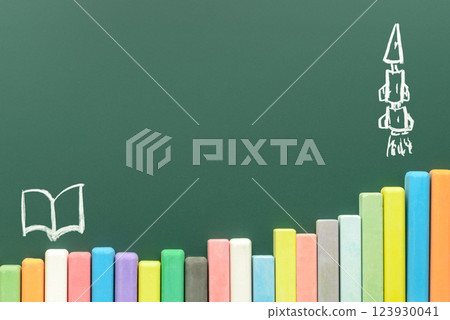 multicolored chalks on green chalkboard background multicolored chalks on green chalkboard background 123930041