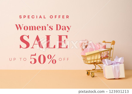 Hello spring, shopping cart, gifts and flowers on light background with text Hello spring, shopping cart, gifts and flowers on light background with text 123931213