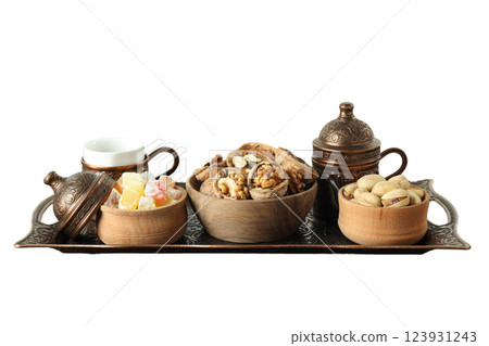 PNG, Ramadan. Copper tray with traditional food - dried fruits, isolated on white background. 123931243