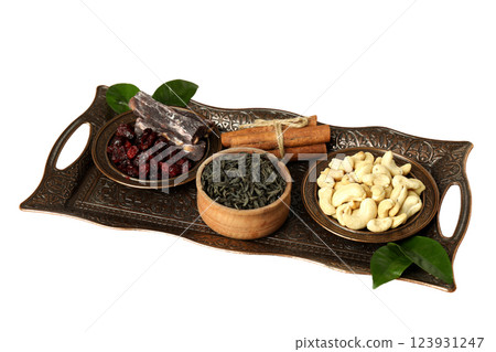 PNG, Ramadan. Copper tray with traditional food - dried fruits, isolated on white background. PNG, Ramadan. Copper tray with traditional food - dried fruits, isolated on white background. 123931247