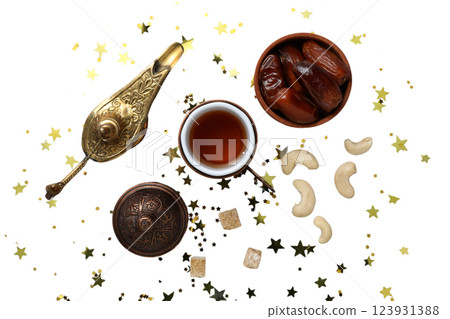 PNG, Ramadan. Dates, cashews with a cup of tea and a lamp, isolated on a white background. 123931388