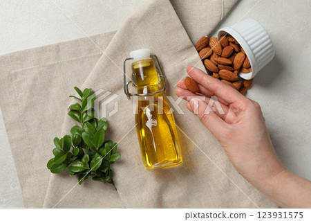 Skin care and body care concept - almonds, almond oil 123931575