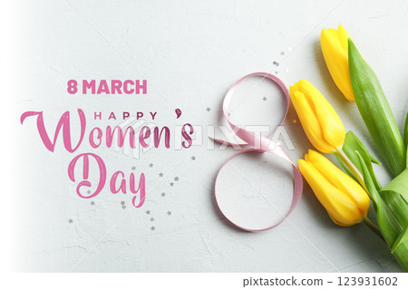 8 March, international women's day, yellow tulips, pink ribbon on a white background, with text, top view 8 March, international women's day, yellow tulips, pink ribbon on a white background, with text, top view 123931602