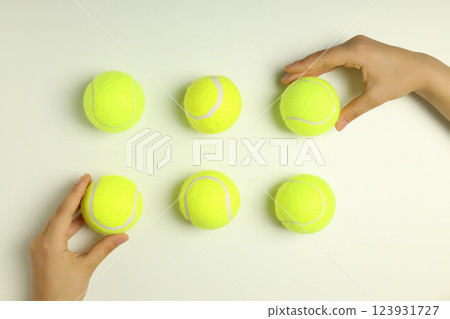 Green tennis balls on a white background 123931727