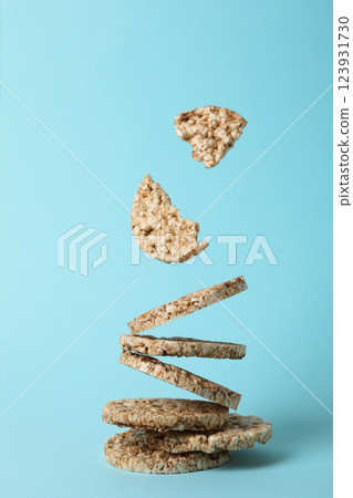 Crisps bread levitated, on a blue background. Crisps bread levitated, on a blue background. 123931730
