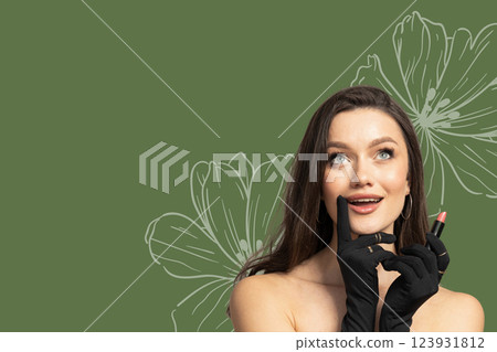 8 March, international women's day, surprised happy woman in black gloves and with lipstick in her hands on a green background, with space for text 123931812