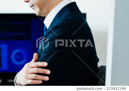 A business man who thinks in front of a personal computer A business man who thinks in front of a personal computer 123932199