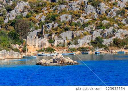 Boats moored at rocky shore of the Mediterranean Sea near Simena in Antalya province, Turkey Boats moored at rocky shore of the Mediterranean Sea near Simena in Antalya province, Turkey 123932554