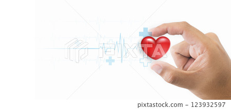 A hand gently holding a red heart, symbolizing care and love, with a medical heartbeat line in the background and symbolizing health and love. Showing the connection between love and healthcare. 123932597