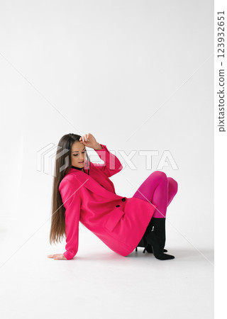 Empowered Woman Posing In Pink Attire 123932651