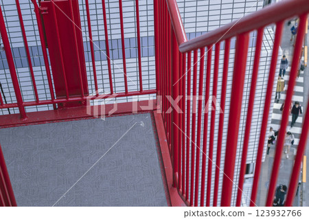 Red steel emergency stairs and fence 123932766