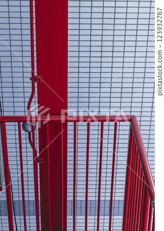 Red steel emergency stairs and fence Red steel emergency stairs and fence 123932767
