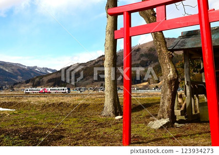 A view of the original Japanese landscape, Tono City, with a view of the shrine and the railway near Ayaori 123934273