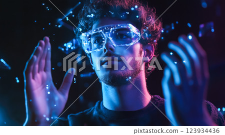 A man wears digital glasses and gazes at a holographic display. Futuristic technology and innovation. Generative AI. 123934436