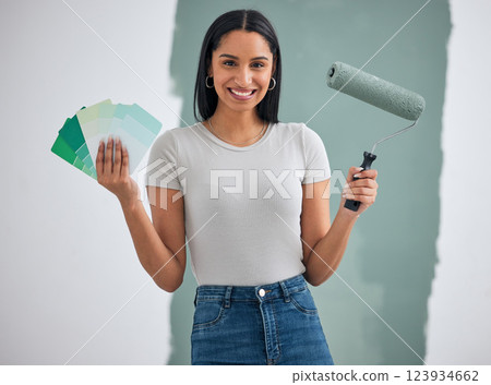 Color card, renovation and woman painting a house, home or apartment room wall green for maintenance. Artistic, designer and creative painter holding a roller and color palette with a happy smile 123934662