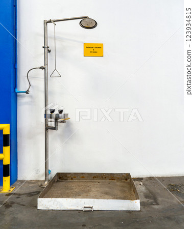 Emergency shower and eye wash station for chemical accident in storage warehouse Emergency shower and eye wash station for chemical accident in storage warehouse 123934815