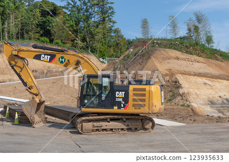 Heavy machinery at a road construction site Heavy machinery at a road construction site 123935633