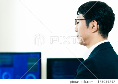 Hands of a man working on a computer 123935852