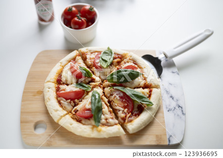 Margherita pizza cut 123936695