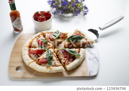 Margherita pizza cut 123936706