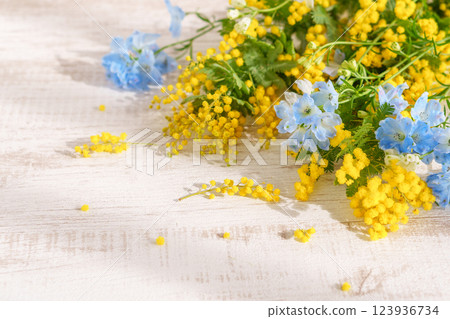 Mimosa and delphinium arrangement Mimosa and delphinium arrangement 123936734