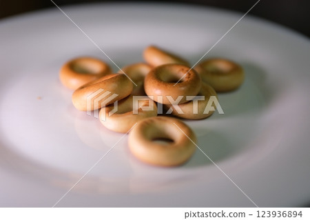 small bagels pretzels Delicious dry bagels sushki or baranki isolated on white background small bagels pretzels Delicious dry bagels sushki or baranki isolated on white background 123936894