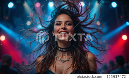 Young Rocker in Ecstasy Portrait of a Girl Shaking Her Hair at a Concert 123937472