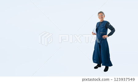 Full-body photo of a craftsman/carpenter holding a helmet 123937549