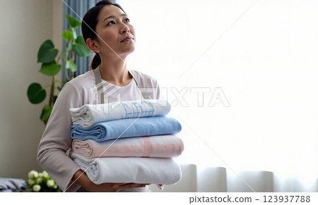 Housewife taking in the laundry 123937788